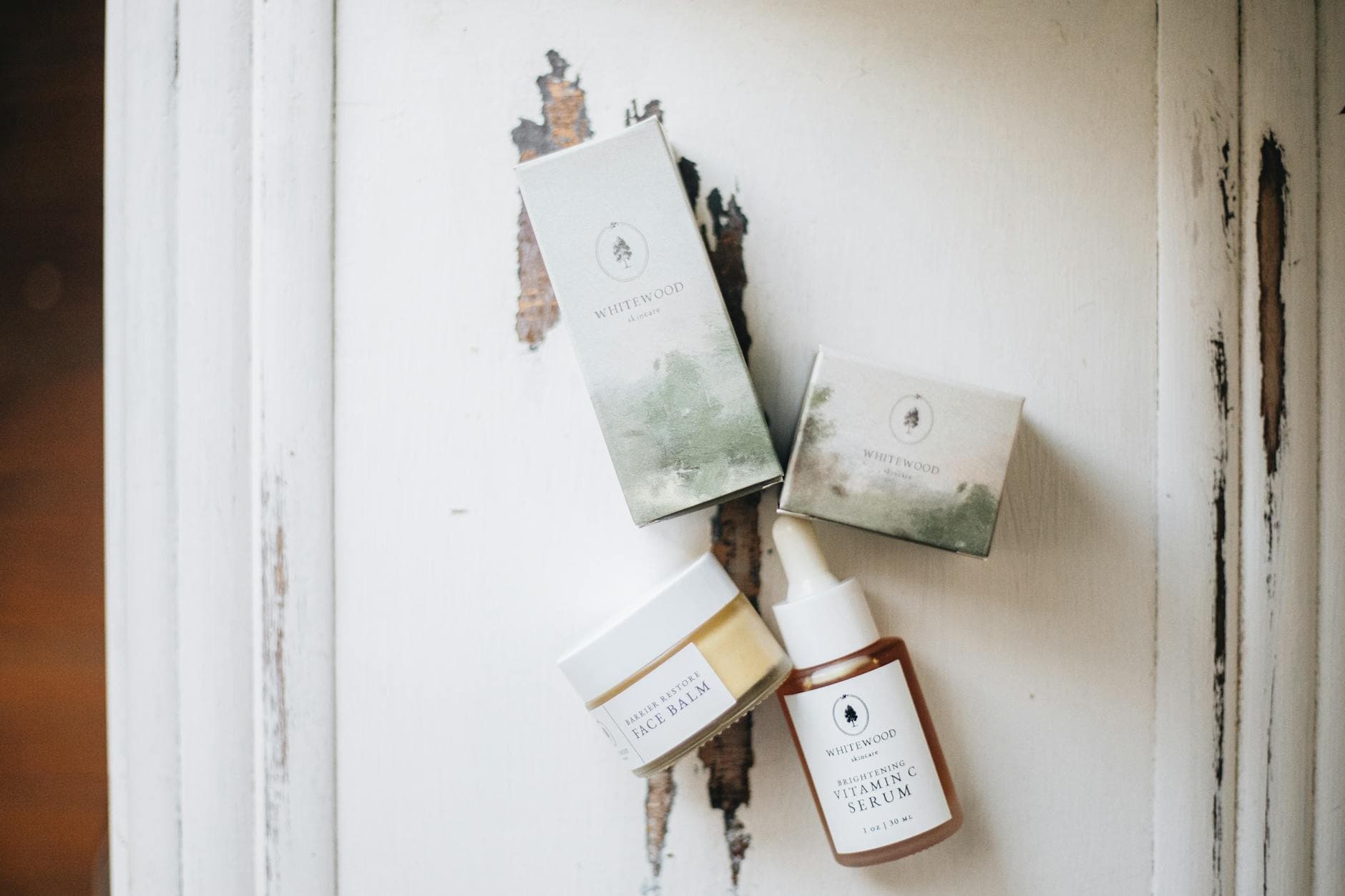A tray of skincare bottles arranged in a flat-lay