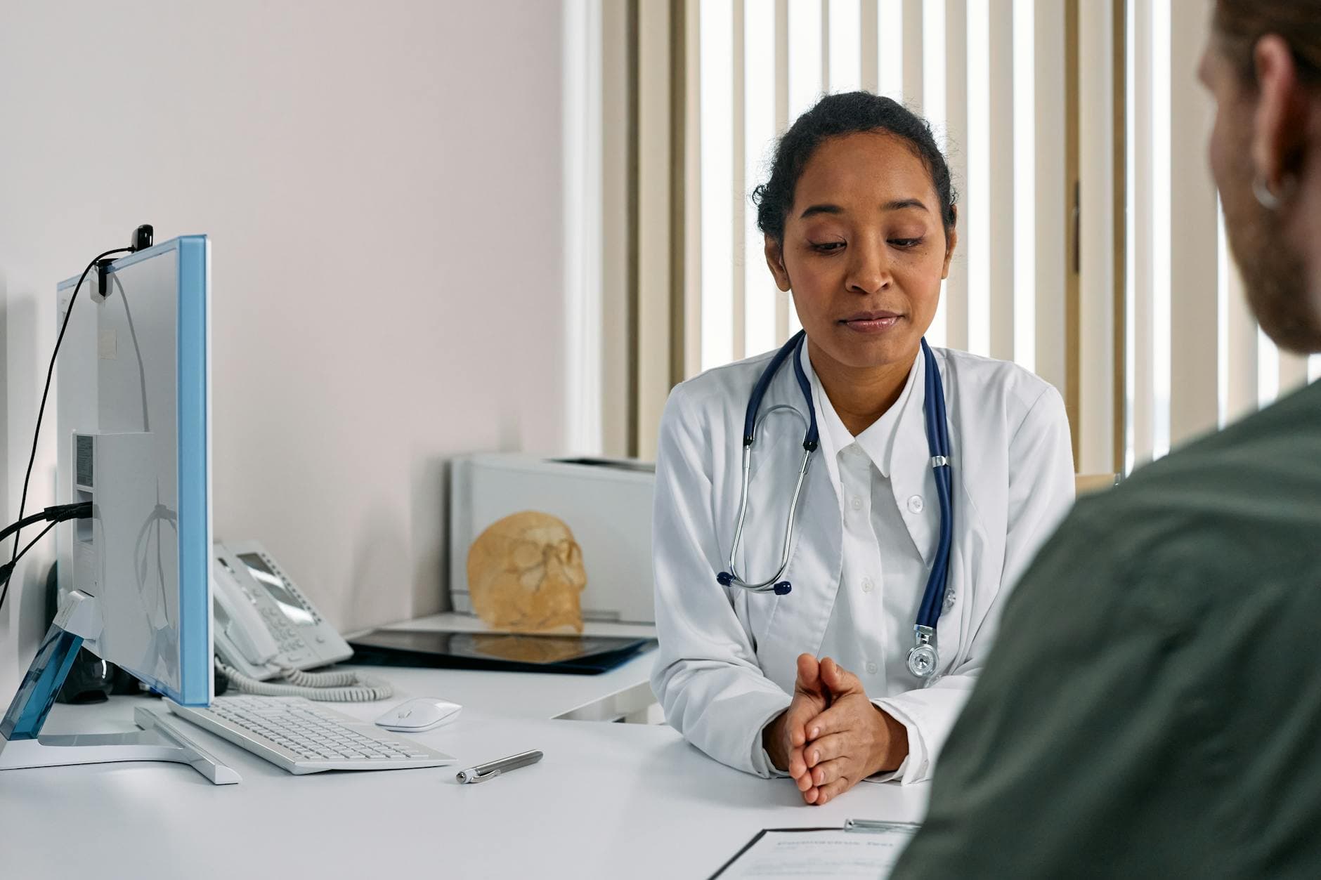A doctor and woman patient in a calm consultation